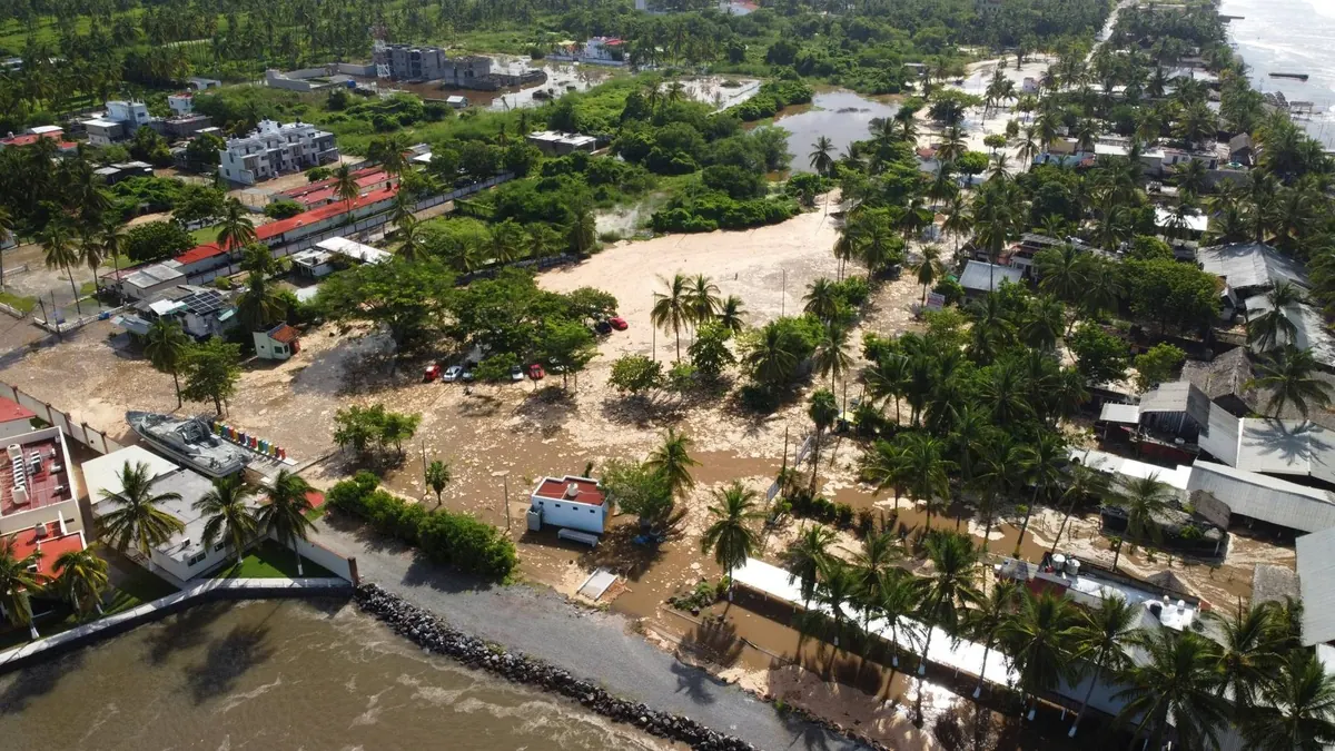 Aerial view of a coastal town flooded by a storm surge